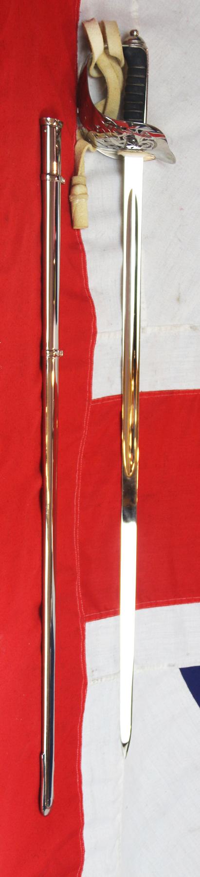 A Very Good Current Service 1897 Pattern ERII Post 1953 Officer's Sword In Nickel Plated Dress Scabbard, with Its Original Buff Hide Knot