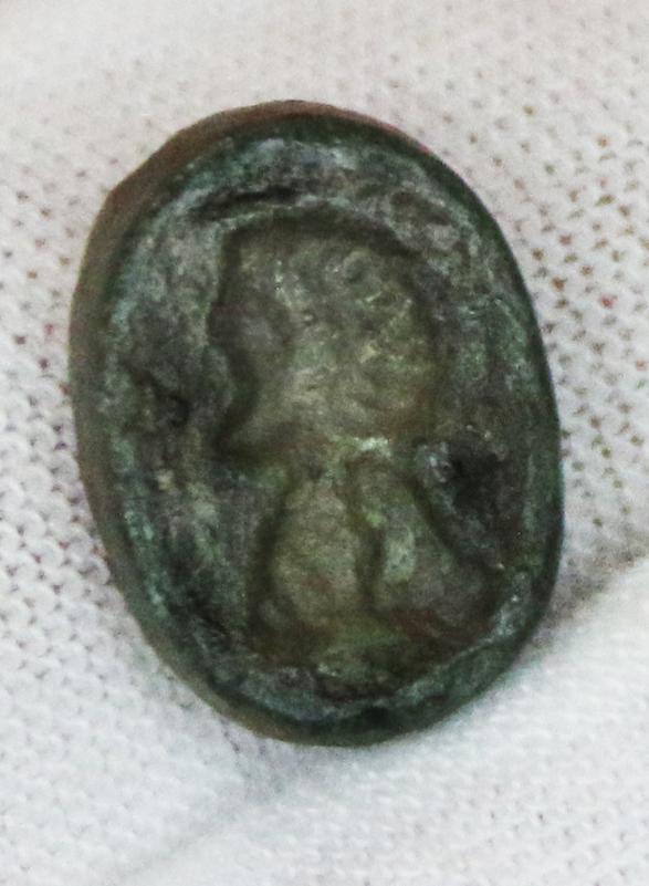 1st 2nd Century Romano British Ellipsoid Glass Ring Mount Depicting the Impressed Head of the Sky God of Thunder Taranis {Roman,Jupiter} or Mithras {Roman, Mars} Of the East of England Mithraic Cult. From the Era of 'King' Caratacus