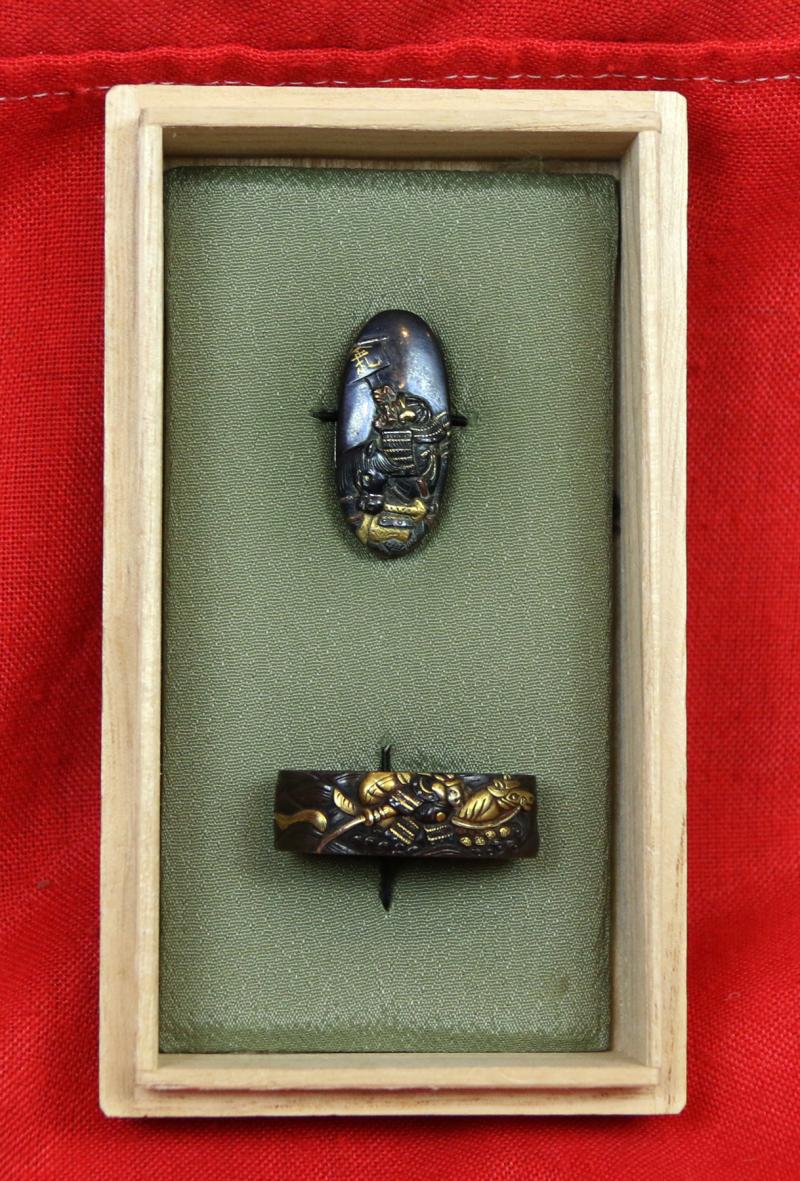 Fine Pair of Samurai Sword Mounts, A Fuchigashira In Pure Gold Onlay & Inlay On Shakudo, Soten School, Edo Period {1615-1868} Inscribed Sōheishi Nyūdō Sōten Sei. Taira Atsumori (1169-1184) Riding On Horseback Through Crashing Waves To Escape The Minamoto