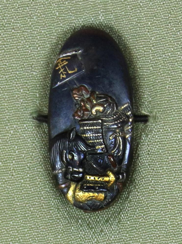 Fine Pair of Samurai Sword Mounts, A Fuchigashira In Pure Gold Onlay & Inlay On Shakudo, Soten School, Edo Period {1615-1868} Inscribed Sōheishi Nyūdō Sōten Sei. Taira Atsumori (1169-1184) Riding On Horseback Through Crashing Waves To Escape The Minamoto