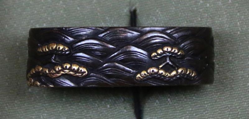 Fine Pair of Samurai Sword Mounts, A Fuchigashira In Pure Gold Onlay & Inlay On Shakudo, Soten School, Edo Period {1615-1868} Inscribed Sōheishi Nyūdō Sōten Sei. Taira Atsumori (1169-1184) Riding On Horseback Through Crashing Waves To Escape The Minamoto