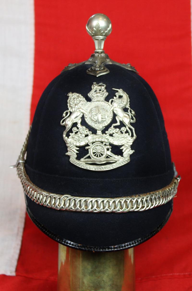 A Beautiful, Victorian, Scottish Artillery Service Helmet of the First Renfrew and Dumbarton Artillery. Blue Cloth with Silver Badge, Fittings, Ball Top, & Rose Head Curb Chain Mounts and Chin Chain