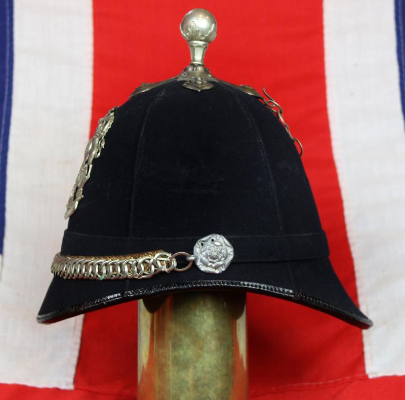 A Beautiful, Victorian, Scottish Artillery Service Helmet of the First Renfrew and Dumbarton Artillery. Blue Cloth with Silver Badge, Fittings, Ball Top, & Rose Head Curb Chain Mounts and Chin Chain