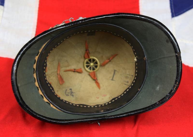 A Beautiful, Victorian, Scottish Artillery Service Helmet of the First Renfrew and Dumbarton Artillery. Blue Cloth with Silver Badge, Fittings, Ball Top, & Rose Head Curb Chain Mounts and Chin Chain