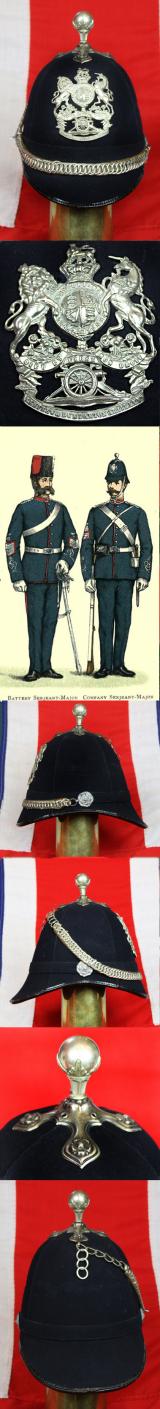 A Beautiful, Victorian, Scottish Artillery Service Helmet of the First Renfrew and Dumbarton Artillery. Blue Cloth with Silver Badge, Fittings, Ball Top, & Rose Head Curb Chain Mounts and Chin Chain