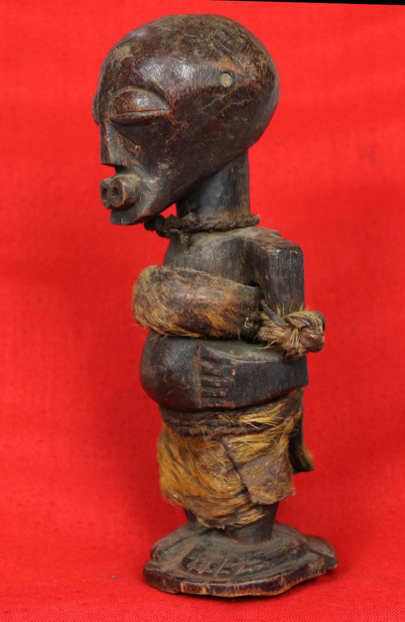 An Original Congolese Songye Fetish Female 'Power Figure'. A Most Beautiful and Perfect Example Of The Combination of Esoteric, Spiritually Symbolic & Cultural African Tribal Art From The Last Century. Late 19th to Early 20th Century.