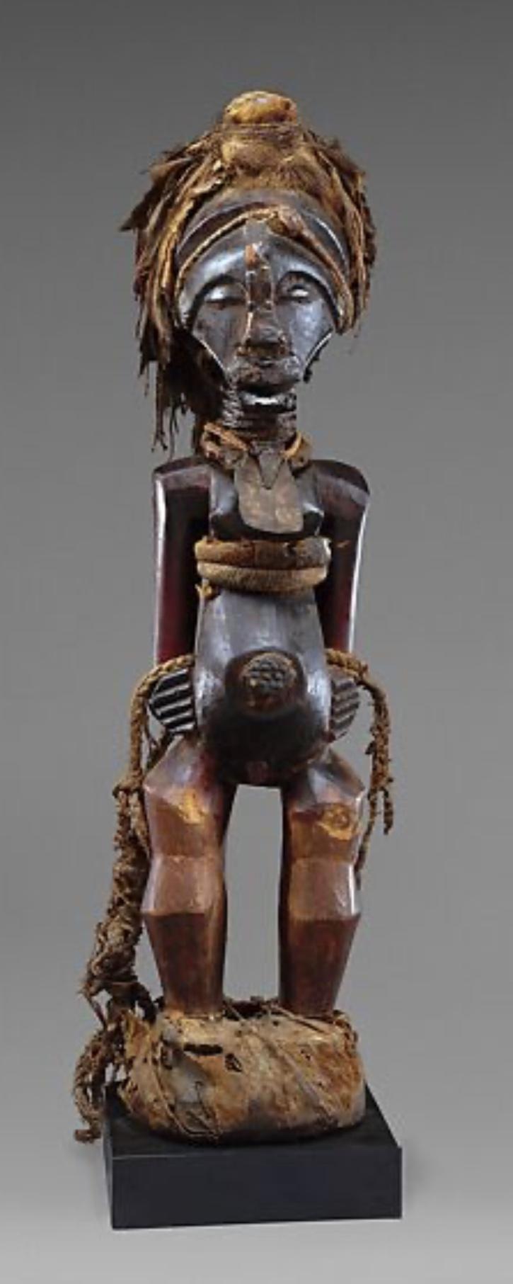 An Original Congolese Songye Fetish Female 'Power Figure'. A Most Beautiful and Perfect Example Of The Combination of Esoteric, Spiritually Symbolic & Cultural African Tribal Art From The Last Century. Late 19th to Early 20th Century.