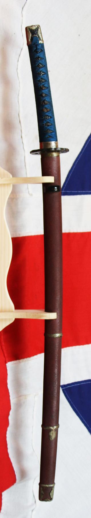 An Ancient Koto Period Samurai Sword, Almost 600 Years old, From The Sengoku Jidai. A Handachi Mounted Katana, With Beautiful Deep Red Ishime Urushi Lacquer Saya, Contrasted With Spectacular Green-Blue Silk Tsuka-ito, Set With Hammered Silver Onlaid Mount