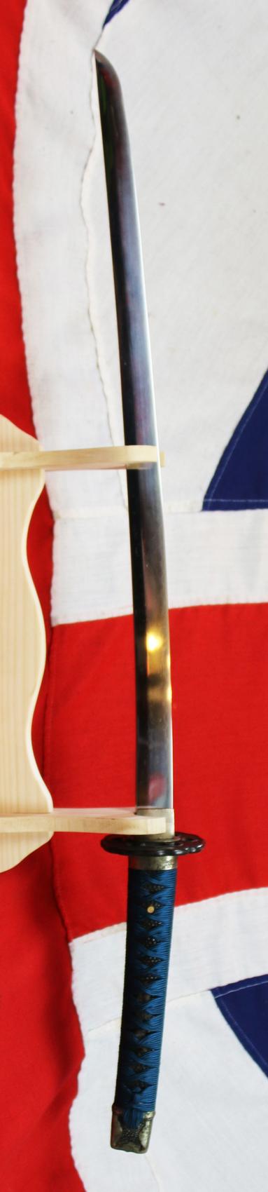 An Ancient Koto Period Samurai Sword, Almost 600 Years old, From The Sengoku Jidai. A Handachi Mounted Katana, With Beautiful Deep Red Ishime Urushi Lacquer Saya, Contrasted With Spectacular Green-Blue Silk Tsuka-ito, Set With Hammered Silver Onlaid Mount