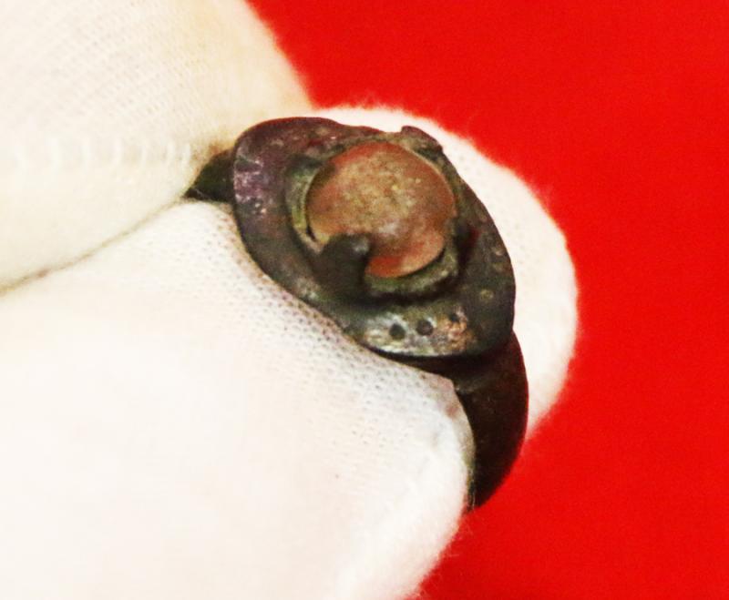 A Wonderful, Around 1200 Year Old Original Viking Bronze Ring, Four Claw Bezel Setting With Its Original Amber Glass Cabochon Gem. Punched Dot Decor Around The Ovoid Surround Of The Claw Setting