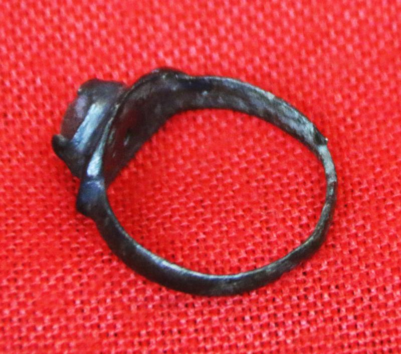 A Wonderful, Around 1200 Year Old Original Viking Bronze Ring, Four Claw Bezel Setting With Its Original Amber Glass Cabochon Gem. Punched Dot Decor Around The Ovoid Surround Of The Claw Setting