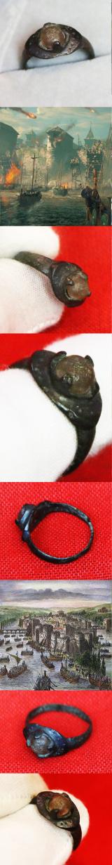 A Wonderful, Around 1200 Year Old Original Viking Bronze Ring, Four Claw Bezel Setting With Its Original Amber Glass Cabochon Gem. Punched Dot Decor Around The Ovoid Surround Of The Claw Setting