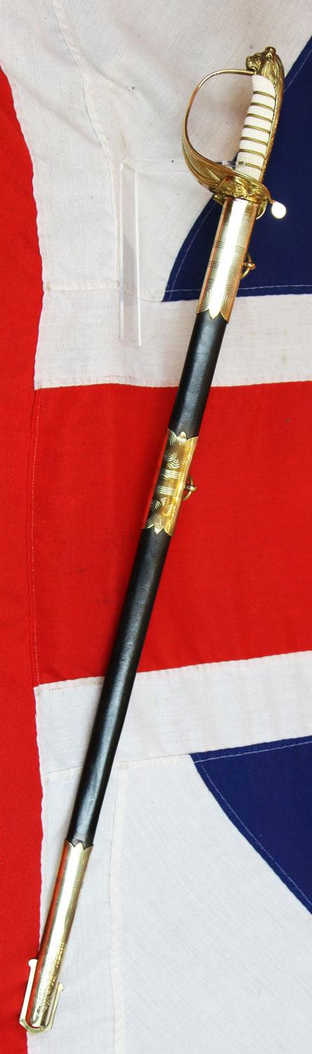 A ERII Royal Naval Officers Sword & Scabbard. Queen Elizabeth Cypher Blade & Traditional Queen's Crown Fouled Anchor Naval Pattern Hilt