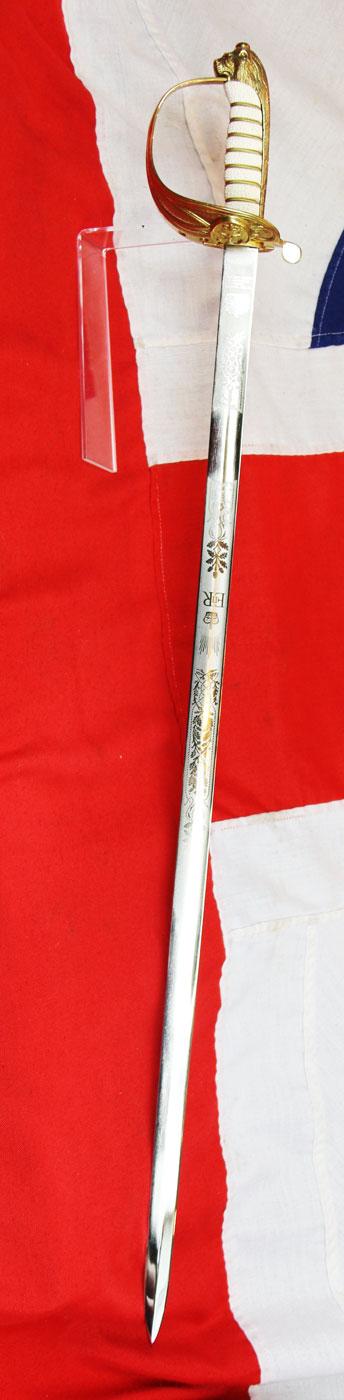A ERII Royal Naval Officers Sword & Scabbard. Queen Elizabeth Cypher Blade & Traditional Queen's Crown Fouled Anchor Naval Pattern Hilt