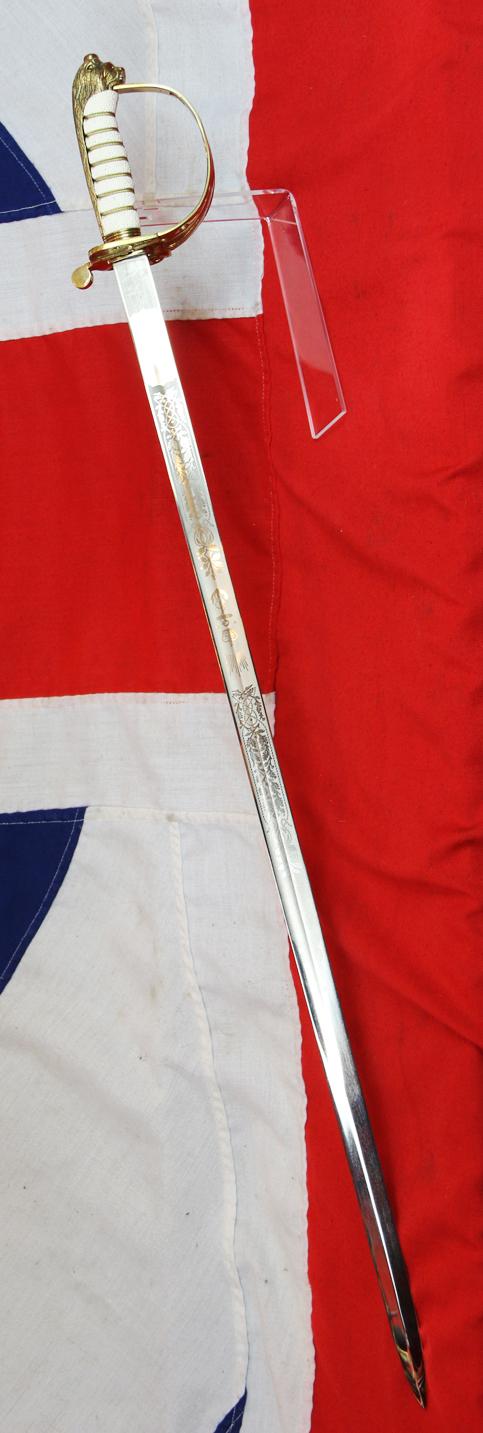 A ERII Royal Naval Officers Sword & Scabbard. Queen Elizabeth Cypher Blade & Traditional Queen's Crown Fouled Anchor Naval Pattern Hilt