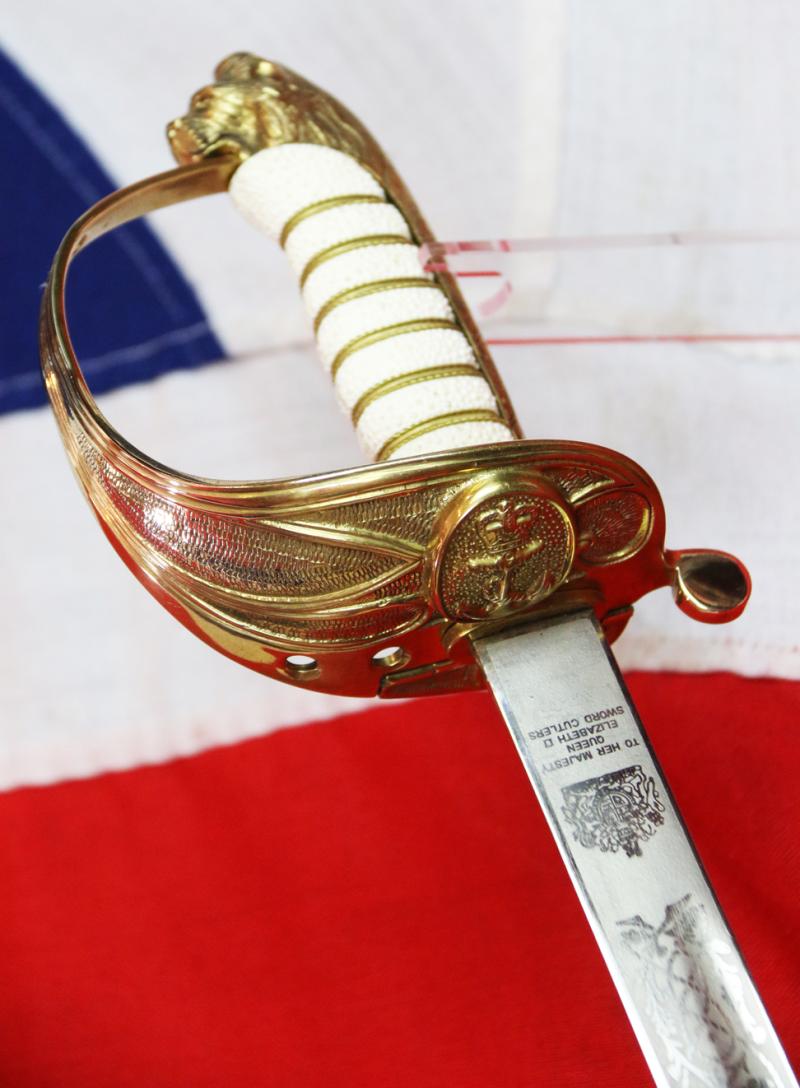 A ERII Royal Naval Officers Sword & Scabbard. Queen Elizabeth Cypher Blade & Traditional Queen's Crown Fouled Anchor Naval Pattern Hilt