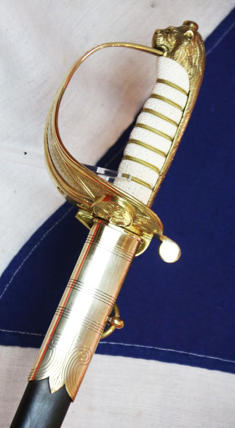 A ERII Royal Naval Officers Sword & Scabbard. Queen Elizabeth Cypher Blade & Traditional Queen's Crown Fouled Anchor Naval Pattern Hilt